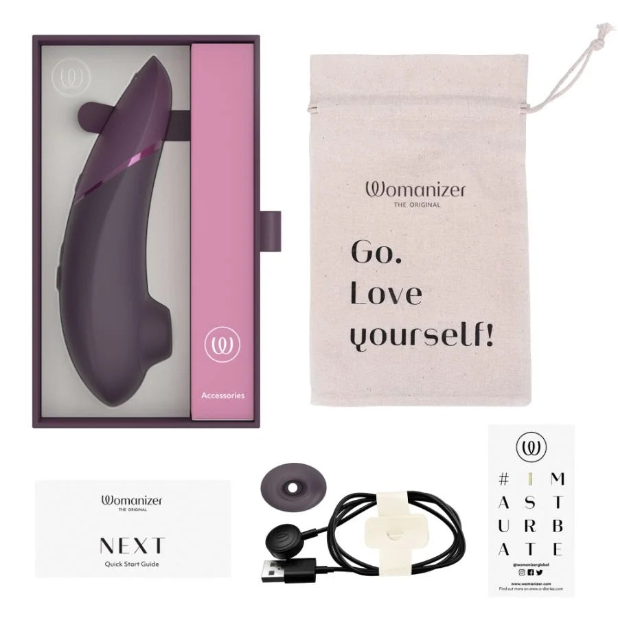 暗紫色Womanizer陰蒂吸啜器，女性性玩具，手持設計，帶有控制按鈕，適合敏感區域刺激。
