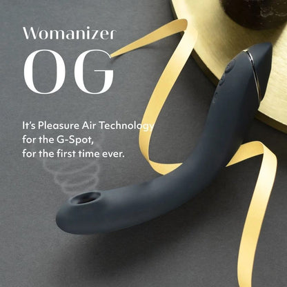 深灰色Womanizer OG Pleasure Air G点吸啜器，女性成人性玩具，便于手持设计。